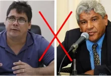 Prof Lucas e Anabal aparecem em uma montagem, com eles sentados em escritórios e um X no meio, indicando um versus o outro
