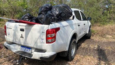 Viatura da reserva biológica cheia de sacos de lixo