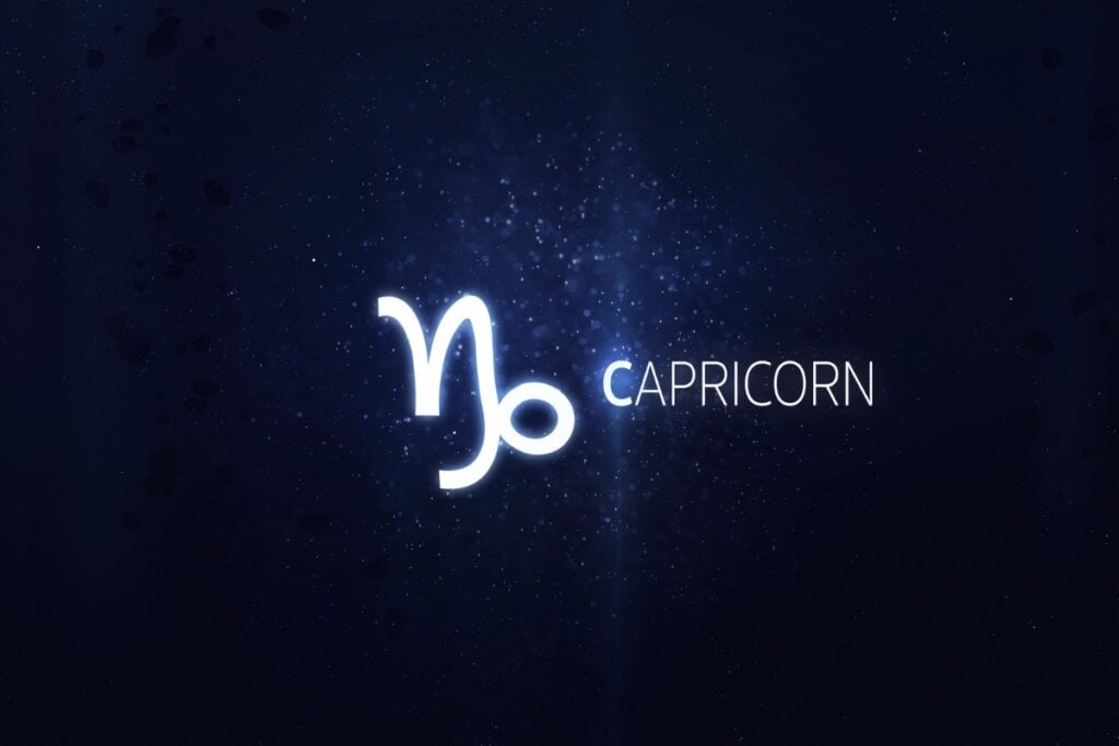 fundo azul brilhando com símbolo e nome do signo de capricórnio